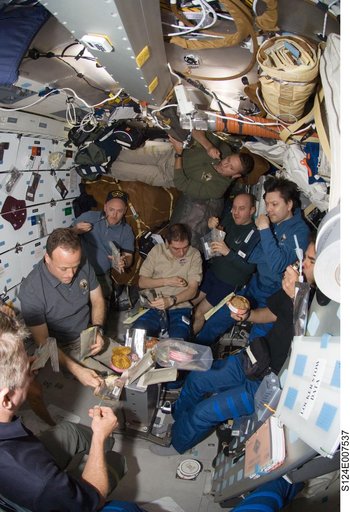 STS-124 and ISS 17 crew on shuttle middeck