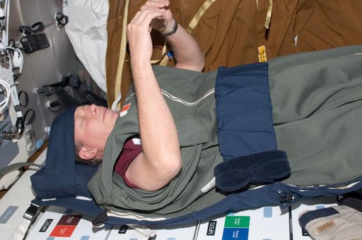 Fossum in sleeping bag on middeck