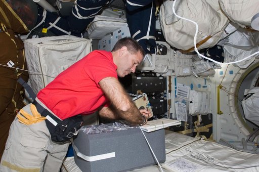 Grunsfeld in the Shuttle Atlantis Middeck