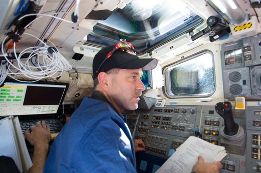 STS-125 Crew working on the Shuttle Atlantis Flight Deck during HST Rendezvous/Berthing