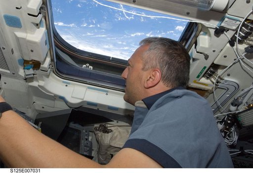 STS-125 Crew working on the Shuttle Atlantis Flight Deck during HST Rendezvous/Berthing