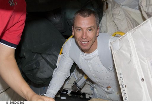 View of MS5 Feustel posing for a photo in the Middeck prior to EVA1