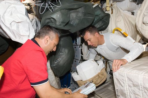 STS-125 Crew Members prepare for EVA1 in the Middeck