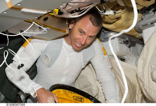 STS-125 MS5 Feustel prepares for EVA1 in the Middeck