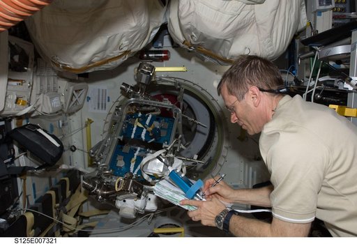 STS-125 MS1 Johnson working in the MDDK