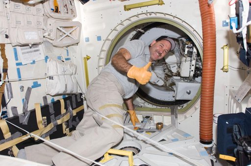 STS-125 MS3 Grunsfeld opens the Atlanis Airlock Hatch after EVA2