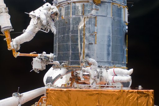 STS-125 MS5 Feustel and MS3 Grunsfeld during EVA3