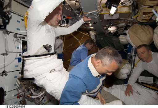 STS-125 Crew Members prepare for EVA3 in the MDDK