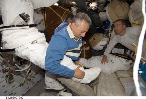 STS-125 Crew Members prepare for EVA3 in the MDDK
