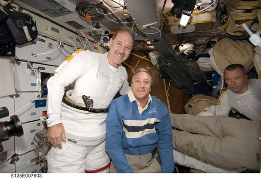 STS-125 Crew Members pose for a photo in the MDDK