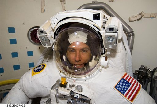 STS-125 MS5 Feustel poses for a photo in the Airlock prior to EVA3