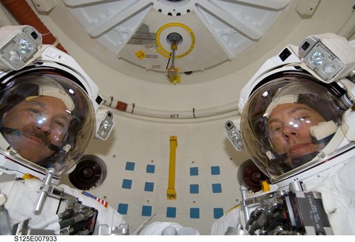 STS-125 MS5 Feustel and MS3 Grunsfeld pose for a photo in the Airlock prior to EVA3
