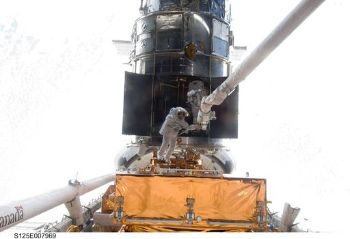 STS-125 MS5 Feustel and MS3 Grunsfeld during EVA3