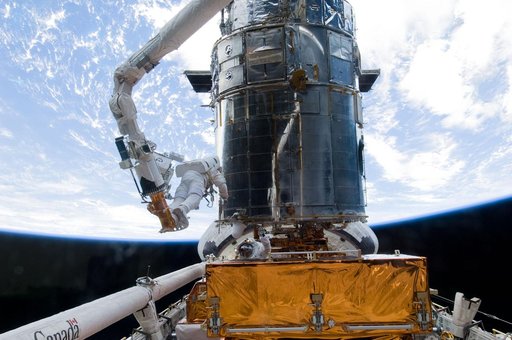 STS-125 MS5 Feustel and MS3 Grunsfeld during EVA3