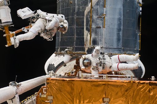 STS-125 MS5 Feustel and MS3 Grunsfeld during EVA3