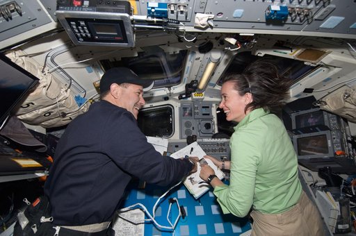 View of STS-125 Crew Members on the Atlantis Flight Deck during Flight Day 7