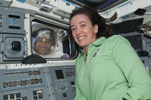 STS-125 Crew Members pose for a photo during Flight Day 7