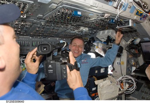 STS-125 Crew Members on the Flight Deck during Flight Day 8