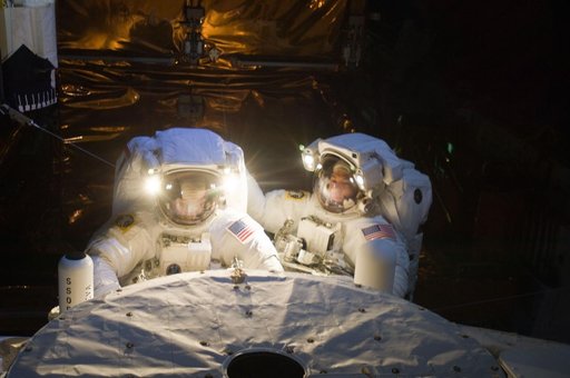 STS-125 MS3 Grunsfeld and MS5 Feustel during EVA5