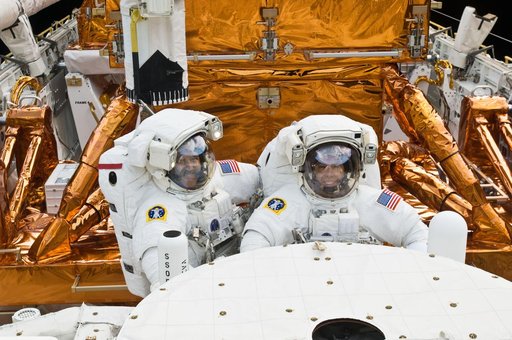 STS-125 MS3 Grunsfeld and MS5 Feustel during EVA5