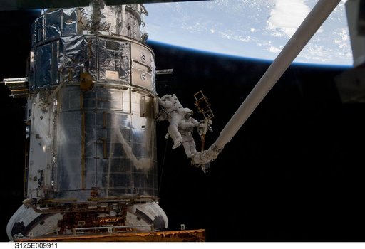 STS-125 MS3 Grunsfeld and MS5 Feustel during EVA5
