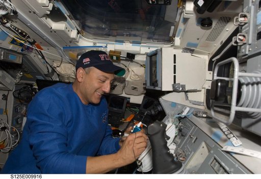 STS-125 MS4 Massimino works on the Flight Deck during Flight Day 8