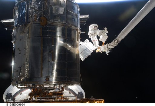 STS-125 MS3 Grunsfeld and MS5 Feustel during EVA5