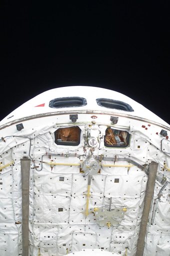 View of STS-125 Crew Members during Flight Day 8 Activities