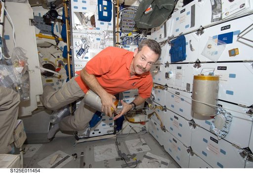 STS-125 CDR Scott Altman replaces LiOH Cannisters on the Shuttle Atlantis Middeck