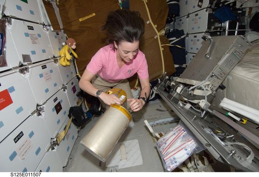 STS-125 MS2 McArthur works with the LiOH Cannisters on the Middeck