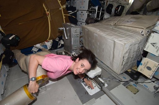 STS-125 MS2 McArthur works with the LiOH Cannisters on the Middeck