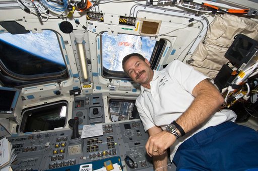 View of STS-125 Commander (CDR) Scott Altman on the Flight Deck