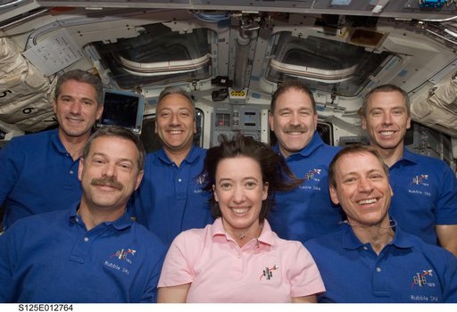 The STS-125 Crew poses for a portrait on the Flight Deck
