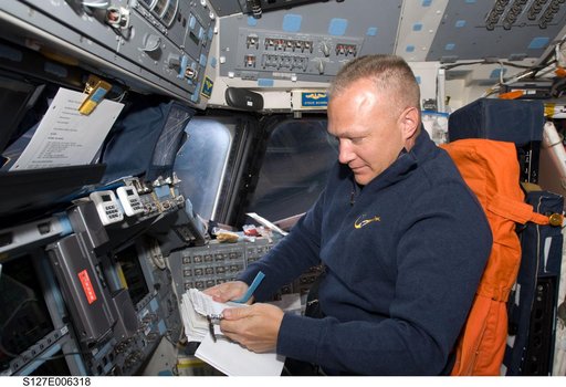 Hurley looks at Crew Procedures in the FD on the Space Shuttle Endeavour during the STS-127 Mission
