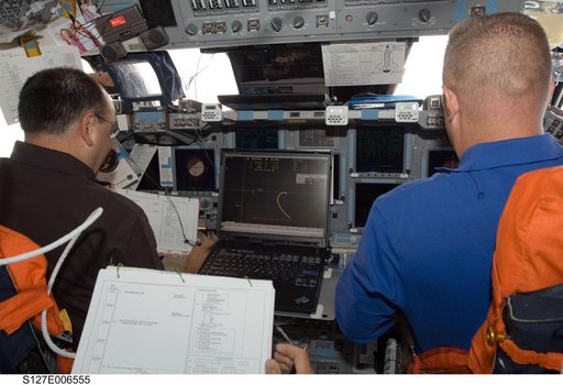 Polanksy and Hurley in the FWD FD on Space Shuttle Endeavour during STS-127 Mission