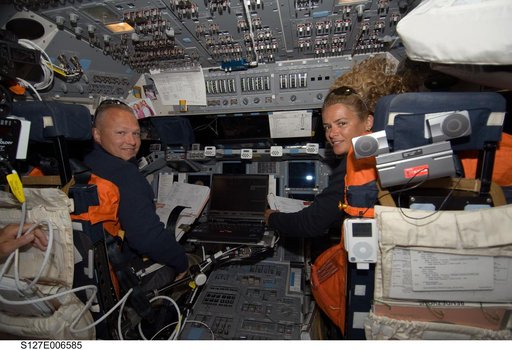 Hurley and Payette in the FWD FD during docking activities of Space Shuttle Endeavour
