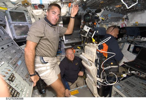Cassidy,Kopra,and Hurley in the FD during docking activities of Space Shuttle Endeavour