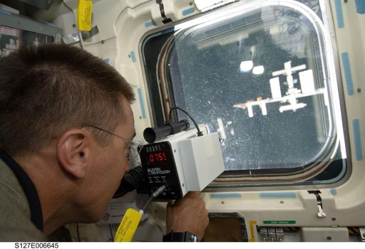 Cassidy uses Laser Ranging Device in the aft FD during docking activities of Space Shuttle Endeavour
