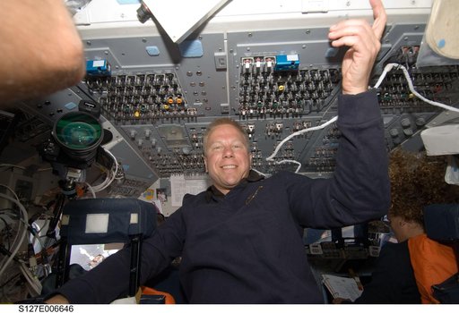 Kopra and Payette in the aft FD during docking activities of Space Shuttle Endeavour