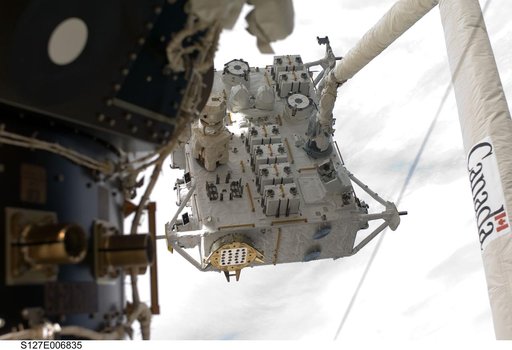 SRMS moves JEF during EVA-1 on STS-127 / Expedition 20 Joint Operations