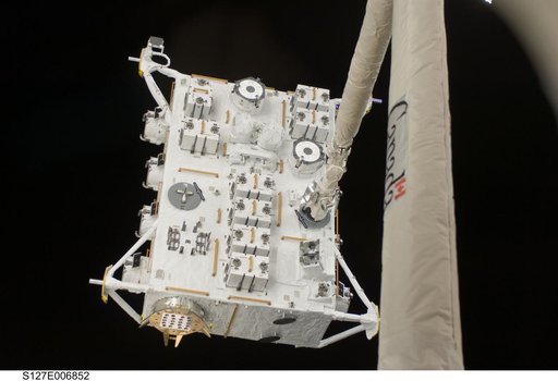 SRMS moves JEF during EVA-1 on STS-127 / Expedition 20 Joint Operations