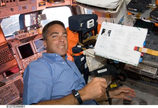 Cassidy looks over Crew Procedures during EVA-1
