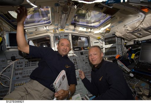 Polansky and Hurley in the aft FD during STS-127 / Expedition 20 Joint Operations