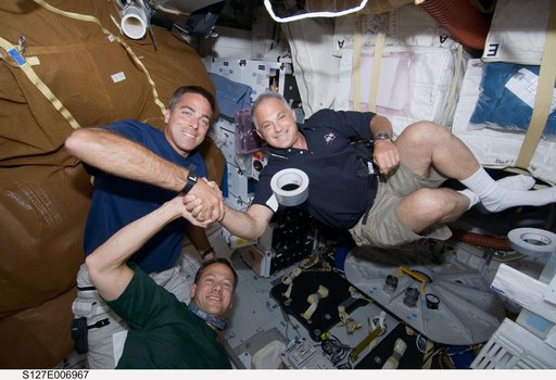 Cassidy,Marshburn,and Wolf in the MDDK during STS-127 / Expedition 20 Joint Operations