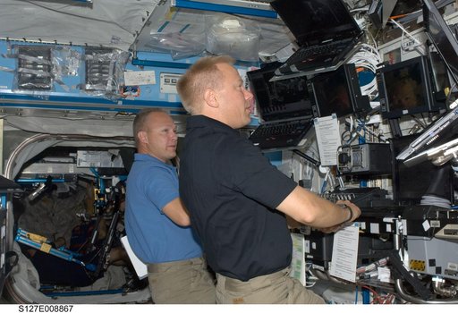 Hurley and Kopra at the RMS in the U.S. Laboratory during Joint Operations