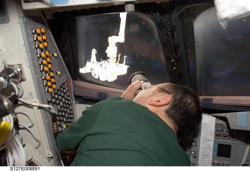 Polansky uses camera in the FD of Endeavour during Joint Operations