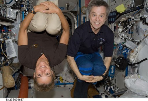 Payette and Thirsk pose in the European Columbus Module