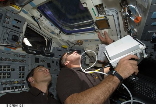 Cassidy holds laser range finder in aft FD during Joint Operations