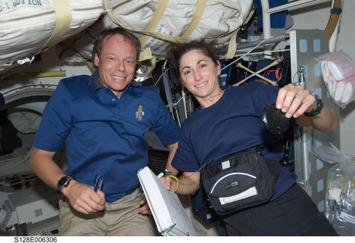Fuglesang and Stott on Middeck (MDDK) during STS-128
