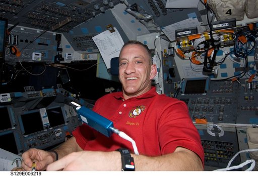 STS-129 CDR Hobaugh poses for a photo on the FD
